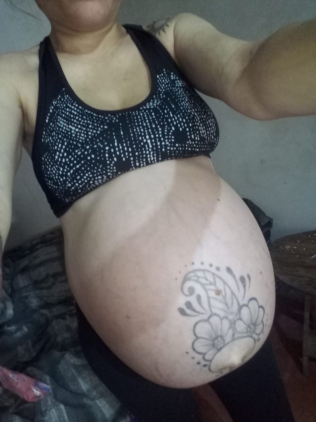 big pregnant belly with tattoo