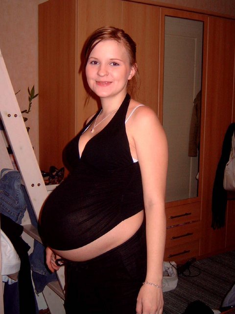 Pregnant women in tight black tights